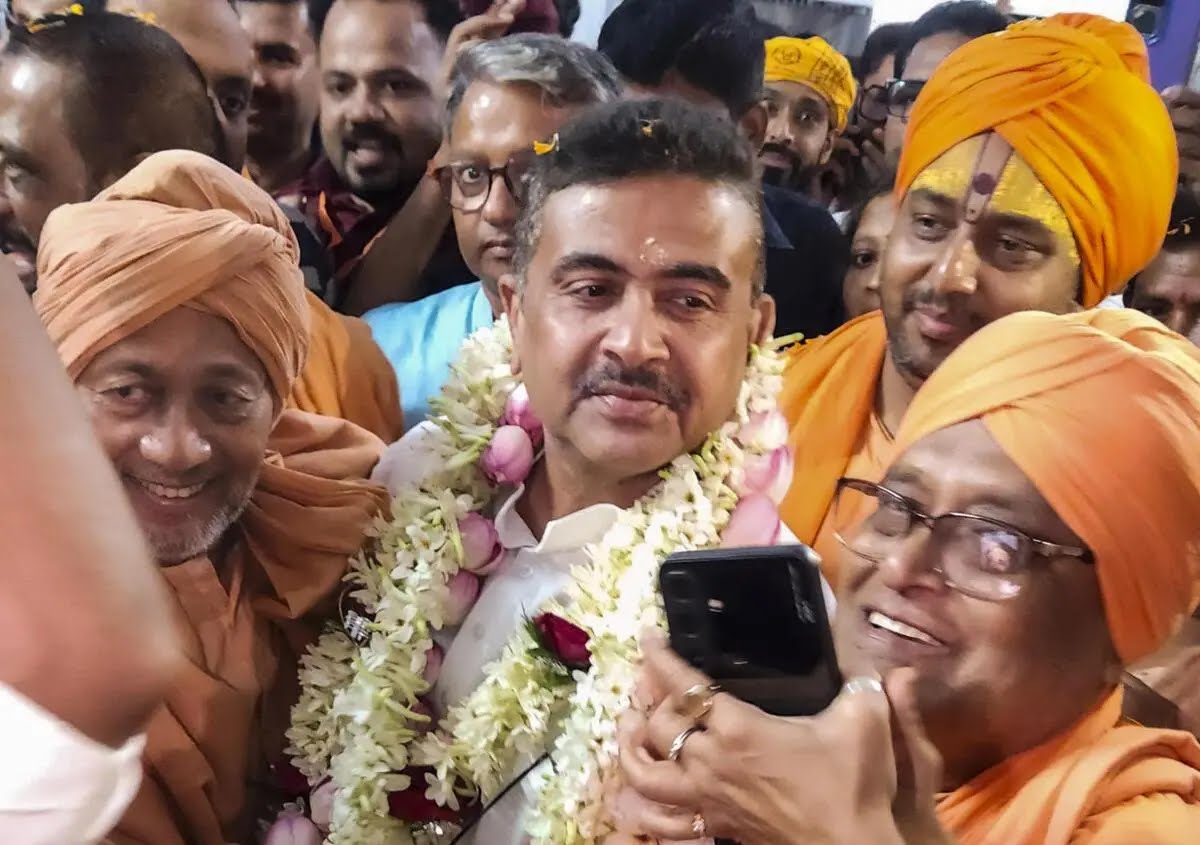Suvendu Adhikari greeted by saints and supporters at a public rally